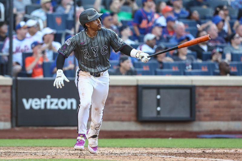 Jul 13, 2024; New York City, New York, USA; New York Mets shortstop Francisco Lindor (12) hits a three run home run in the eighth inning against the Colorado Rockies at Citi Field. Mandatory Credit: Wendell Cruz-USA TODAY Sports