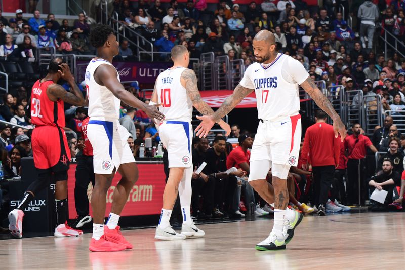 LOS ANGELES, CA - APIRL 14: PJ Tucker #17 and Kobe Brown #21 of the LA Clippers high five during the game against the Houston Rockets on April 14, 2024 at Crypto.Com Arena in Los Angeles, California. NOTE TO USER: User expressly acknowledges and agrees that, by downloading and/or using this Photograph, user is consenting to the terms and conditions of the Getty Images License Agreement. Mandatory Copyright Notice: Copyright 2024 NBAE (Photo by Adam Pantozzi/NBAE via Getty Images)