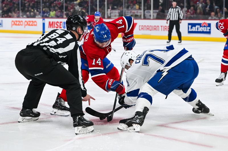 Apr 4, 2024; Montreal, Quebec, CAN; NHL linesman Ryan Jackson (84) drops the puck at face-off between Nick Suzuki Right Wing (14) and Tampa Bay Lightning center Anthony Cirelli (71) during the first period at Bell Centre. Mandatory Credit: David Kirouac-USA TODAY Sports