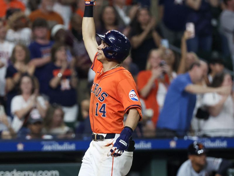 Jun 14, 2024; Houston, Texas, USA; Houston Astros first baseman Mauricio Dubon (14) reacts to his two-run home run against the Detroit Tigers in the sixth inning at Minute Maid Park. Mandatory Credit: Thomas Shea-USA TODAY Sports