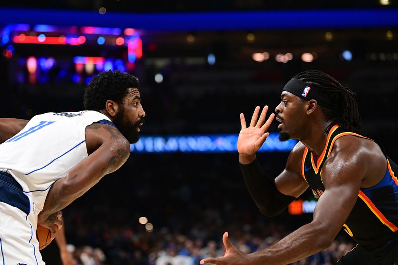 OKLAHOMA CITY, OKLAHOMA - NOVEMBER 17: Kyrie Irving #11 of the Dallas Mavericks handles the ball in front of Luguentz Dort #5 of the Oklahoma City Thunder during the second half at Paycom Center on November 17, 2024 in Oklahoma City, Oklahoma. NOTE TO USER: User expressly acknowledges and agrees that, by downloading and or using this photograph, User is consenting to the terms and conditions of the Getty Images License Agreement. (Photo by Joshua Gateley/Getty Images)