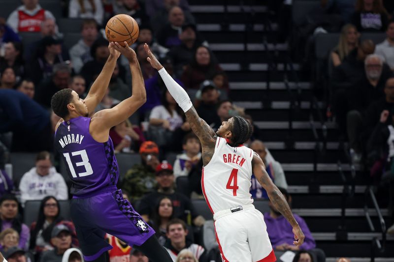 SACRAMENTO, CALIFORNIA - DECEMBER 03: Keegan Murray #13 of the Sacramento Kings shoots over Jalen Green #4 of the Houston Rockets in the first half at Golden 1 Center on December 03, 2024 in Sacramento, California. NOTE TO USER: User expressly acknowledges and agrees that, by downloading and/or using this photograph, user is consenting to the terms and conditions of the Getty Images License Agreement.   (Photo by Ezra Shaw/Getty Images)