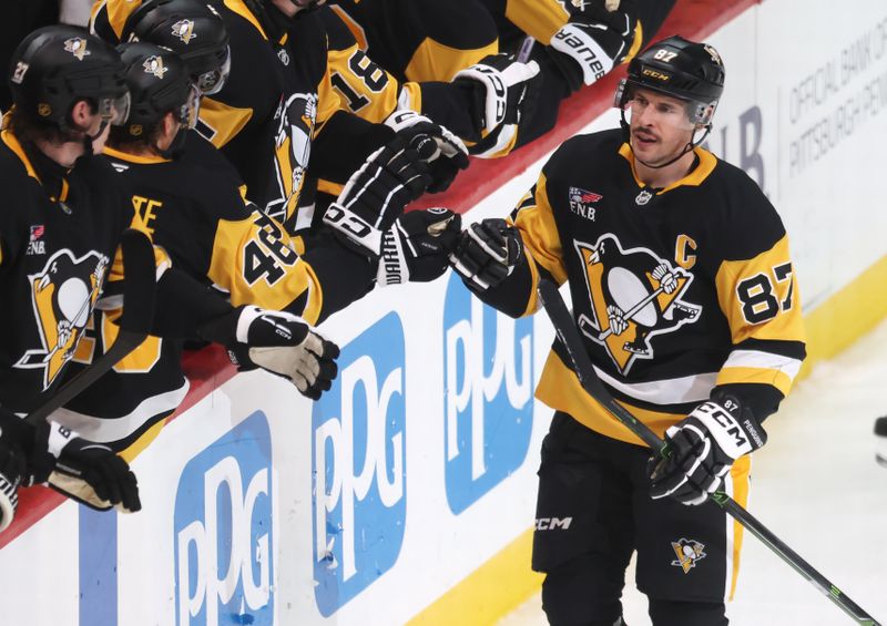 Nov 29, 2025; Pittsburgh, Pennsylvania, USA;  Pittsburgh Penguins center Sidney Crosby (87) celebrates his goal with the Penguins bench against the Toronto Maple Leafs during the third period at PPG Paints Arena. Mandatory Credit: Charles LeClaire-Imagn Images
