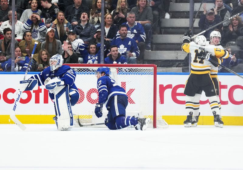 Apr 8, 2024; Toronto, Ontario, CAN; Pittsburgh Penguins left wing Drew O'Connor (10) scores a goal and celebrates with right wing Bryan Rust (17) against the Toronto Maple Leafs during the third period at Scotiabank Arena. Mandatory Credit: Nick Turchiaro-USA TODAY Sports