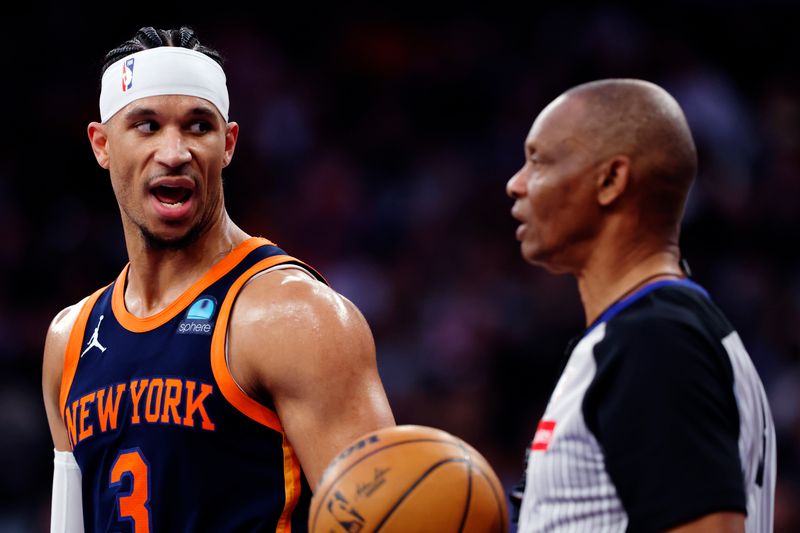 NEW YORK, NEW YORK - APRIL 04: Josh Hart #3 of the New York Knicks talks with referee Michael Smith #38 during the second half against the Sacramento Kings at Madison Square Garden on April 04, 2024 in New York City. The Knicks won 120-109. NOTE TO USER: User expressly acknowledges and agrees that, by downloading and/or using this Photograph, user is consenting to the terms and conditions of the Getty Images License Agreement. (Photo by Sarah Stier/Getty Images)