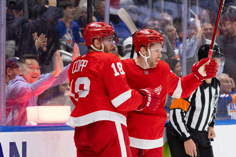 Oct 30, 2023; Elmont, New York, USA; Detroit Red Wings left wing J.T. Compher (37) celebrates his goal with center Andrew Copp (18) against the New York Islanders during the third period at UBS Arena. Mandatory Credit: Thomas Salus-USA TODAY Sports