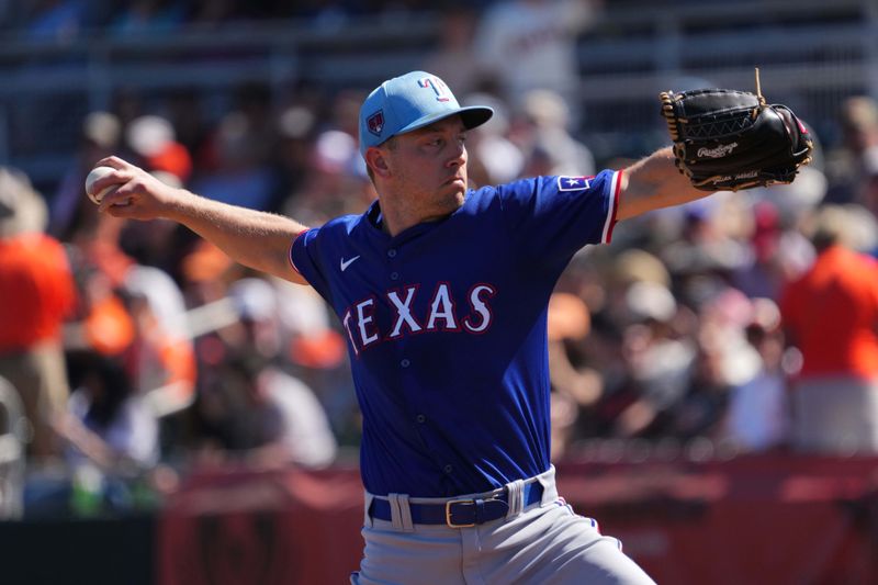 Mar 1, 2024; Scottsdale, Arizona, USA; Texas Rangers starting pitcher Adrian Sampson (50) pitches against the San Francisco Giants during the first inning at Scottsdale Stadium. Mandatory Credit: Joe Camporeale-USA TODAY Sports