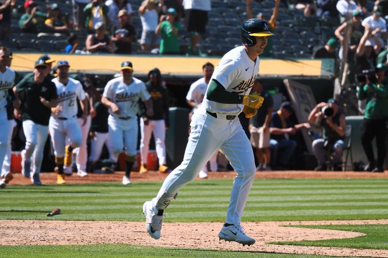 May 23, 2024; Oakland, California, USA; Oakland Athletics pinch hitter Tyler Soderstrom (21) earns a walk for a walk-off win against the Colorado Rockies during the eleventh inning at Oakland-Alameda County Coliseum. Mandatory Credit: Kelley L Cox-USA TODAY Sports