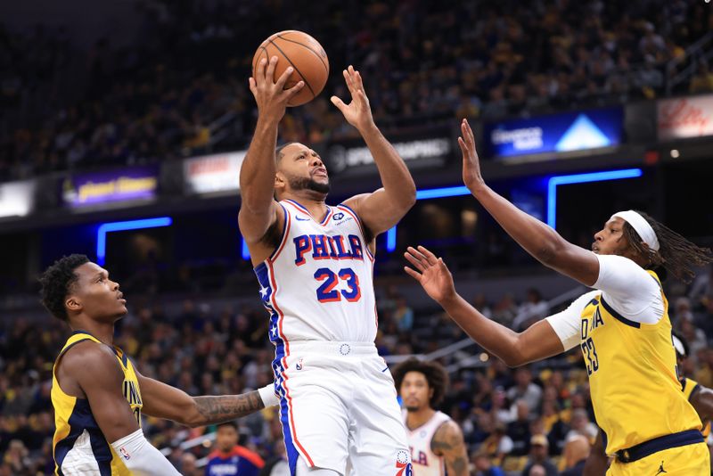INDIANAPOLIS, INDIANA - OCTOBER 27: Eric Gordon #23 of the Philadelphia 76ers takes a shot against Myles Turner #33 and Bennedict Mathurin #00 of the Indiana Pacers during the first half at Gainbridge Fieldhouse on October 27, 2024 in Indianapolis, Indiana. NOTE TO USER: User expressly acknowledges and agrees that, by downloading and or using this photograph, User is consenting to the terms and conditions of the Getty Images License Agreement. (Photo by Justin Casterline/Getty Images)