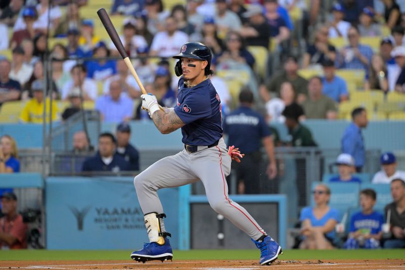 Jul 19, 2024; Los Angeles, California, USA;  Boston Red Sox outfielder Jarren Duran (16) hits a lead off double in the first inning against the Los Angeles Dodgers at Dodger Stadium. Mandatory Credit: Jayne Kamin-Oncea-USA TODAY Sports