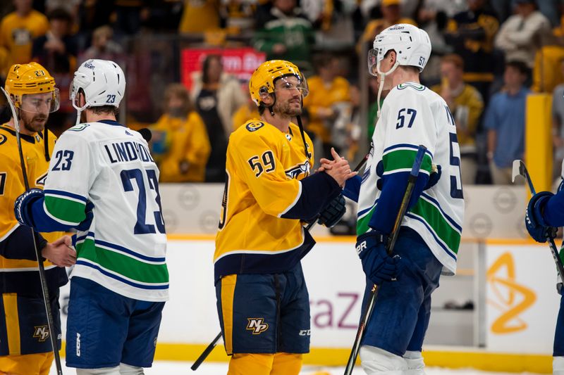 May 3, 2024; Nashville, Tennessee, USA; Nashville Predators defenseman Roman Josi (59) and Vancouver Canucks defenseman Tyler Myers (57) shake hands following game six of the first round of the 2024 Stanley Cup Playoffs at Bridgestone Arena. Mandatory Credit: Steve Roberts-USA TODAY Sports