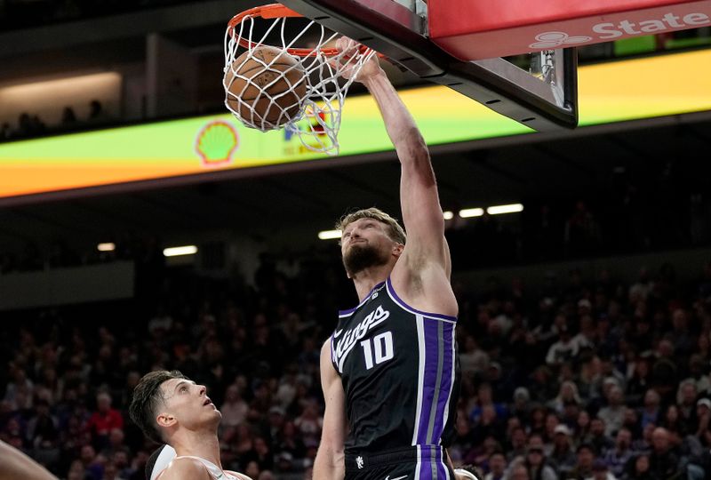 SACRAMENTO, CALIFORNIA - MARCH 07: Domantas Sabonis #10 of the Sacramento Kings slam dunks against the San Antonio Spurs during the second half at Golden 1 Center on March 07, 2024 in Sacramento, California. NOTE TO USER: User expressly acknowledges and agrees that, by downloading and or using this photograph, User is consenting to the terms and conditions of the Getty Images License Agreement. (Photo by Thearon W. Henderson/Getty Images)