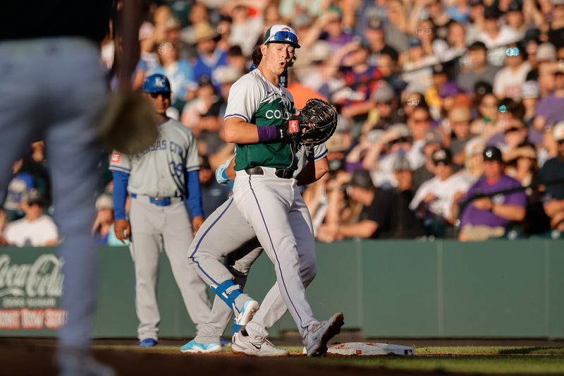 Jul 6, 2024; Denver, Colorado, USA; Colorado Rockies first baseman Michael Toglia (4) reacts after fielding a throw looking into the sun in the second inning against the Kansas City Royals at Coors Field. Mandatory Credit: Isaiah J. Downing-USA TODAY Sports