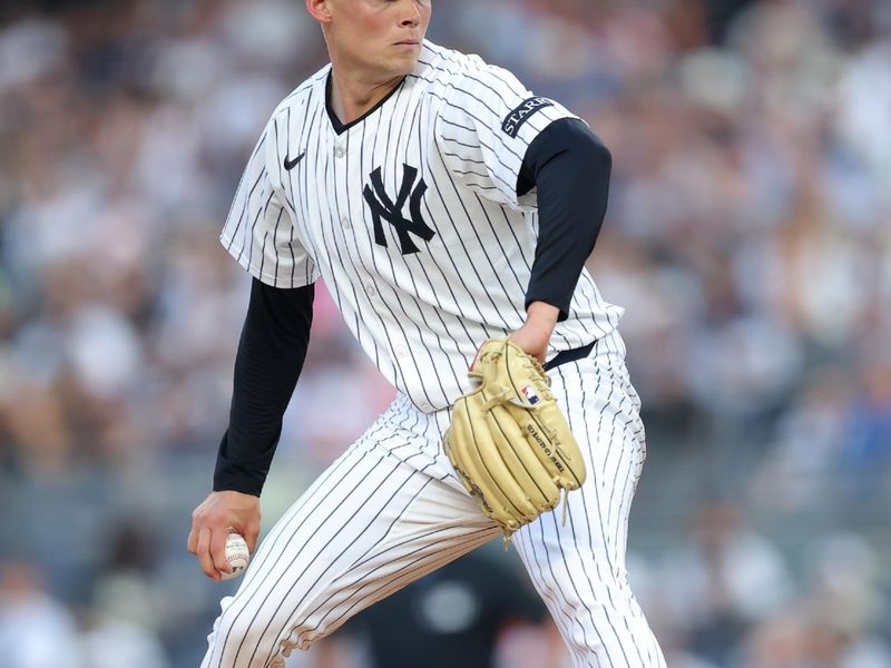 Jun 6, 2025; Bronx, New York, USA; New York Yankees starting pitcher Will Warren (98) pitches against the Boston Red Sox during the first inning at Yankee Stadium. Mandatory Credit: Brad Penner-Imagn Images