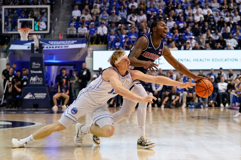 Jan 26, 2026; Provo, Utah, USA; BYU Cougars guard Richie Saunders (15) and Arizona Wildcats guard Jaden Bradley (0) dive for a loose ball during the first half at Marriott Center. Mandatory Credit: Aaron Baker-Imagn Images