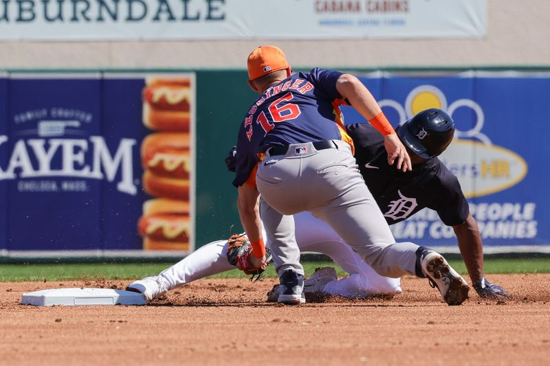 Feb 26, 2024; Lakeland, Florida, USA; Detroit Tigers center fielder Riley Greene (31) slides out into second during the first inning against the Houston Astros at Publix Field at Joker Marchant Stadium. Mandatory Credit: Mike Watters-USA TODAY Sports