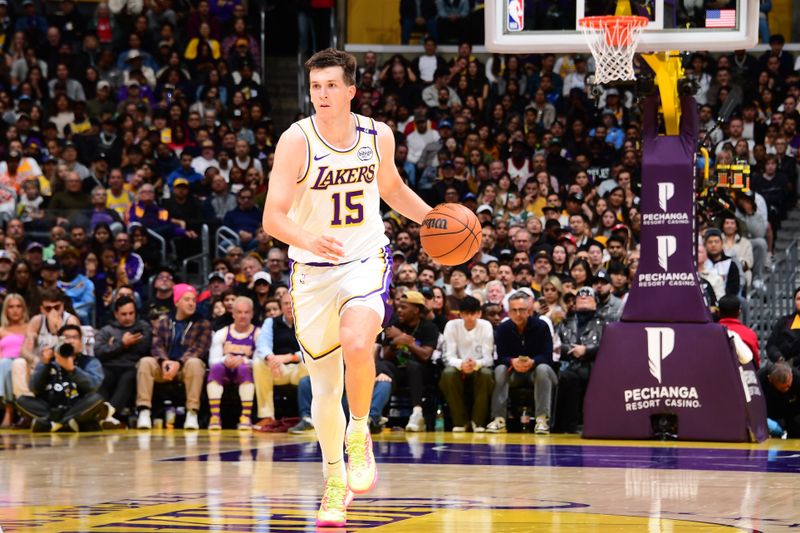 LOS ANGELES, CA - NOVEMBER 23: Austin Reaves #15 of the Los Angeles Lakers dribbles the ball during the game against the Denver Nuggets on November 23, 2024 at Crypto.Com Arena in Los Angeles, California. NOTE TO USER: User expressly acknowledges and agrees that, by downloading and/or using this Photograph, user is consenting to the terms and conditions of the Getty Images License Agreement. Mandatory Copyright Notice: Copyright 2024 NBAE (Photo by Adam Pantozzi/NBAE via Getty Images)