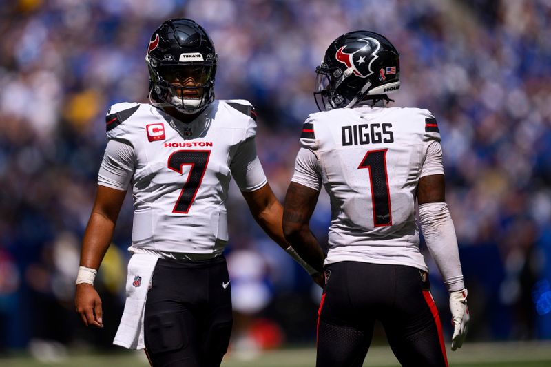 Houston Texans quarterback C.J. Stroud (7) and Houston Texans wide receiver Stefon Diggs (1) huddle on the field during an NFL football game against the Indianapolis Colts, Sunday, Sept. 8, 2024, in Indianapolis. (AP Photo/Zach Bolinger)