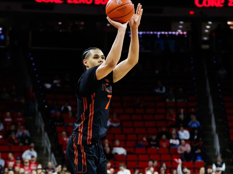 Jan 30, 2024; Raleigh, North Carolina, USA; Miami (Fl) Hurricanes guard Kyshawn George (7) shoots the ball during the second half against North Carolina State Wolfpack at PNC Arena. Mandatory Credit: Jaylynn Nash-USA TODAY Sports