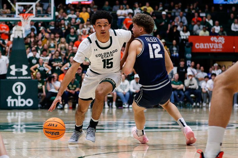 Mar 1, 2025; Fort Collins, Colorado, USA; Colorado State Rams guard Jalen Lake (15) drives tot the basket against Utah State Aggies guard Mason Falslev (12) in the first half at Moby Arena. Mandatory Credit: Isaiah J. Downing-Imagn Images