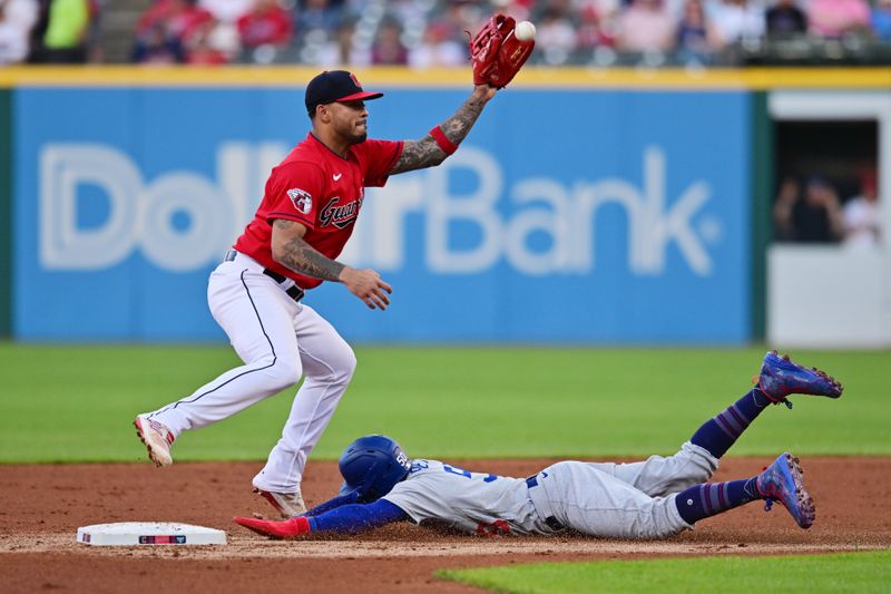 Aug 22, 2023; Cleveland, Ohio, USA; Los Angeles Dodgers second baseman Mookie Betts (50) steals second as Cleveland Guardians shortstop Gabriel Arias (13) waits for the throw during the third inning at Progressive Field. Mandatory Credit: Ken Blaze-USA TODAY Sports