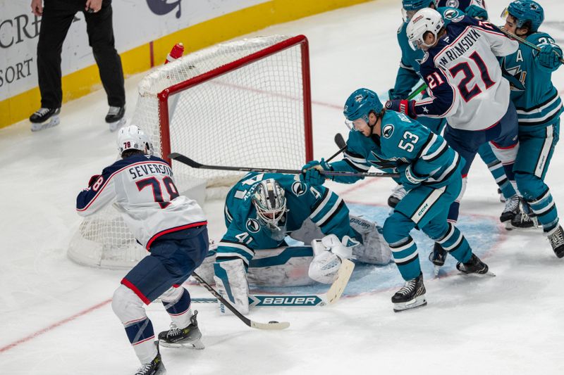 Nov 5, 2024; San Jose, California, USA;  San Jose Sharks goaltender Vitek Vanecek (41) makes a save against Columbus Blue Jackets defenseman Damon Severson (78) during the third period at SAP Center at San Jose. Mandatory Credit: Neville E. Guard-Imagn Images