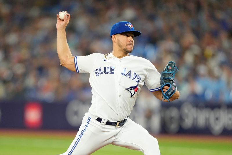 Jul 19, 2023; Toronto, Ontario, CAN; Toronto Blue Jays starting pitcher Jose Berrios (17) pitches to the San Diego Padres during the first inning at Rogers Centre. Mandatory Credit: John E. Sokolowski-USA TODAY Sports