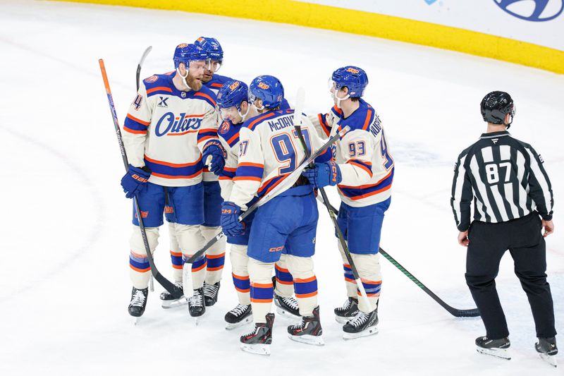 Jan 12, 2026; Chicago, Illinois, USA; Edmonton Oilers left wing Zach Hyman (18) celebrates with teammates after scoring against the Chicago Blackhawks during the first period at United Center. Mandatory Credit: Kamil Krzaczynski-Imagn Images