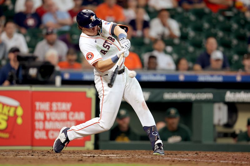 Sep 12, 2024; Houston, Texas, USA; Houston Astros center fielder Jake Meyers (6) hits an RBI double against the Oakland Athletics during the eighth inning at Minute Maid Park. Mandatory Credit: Erik Williams-Imagn Images