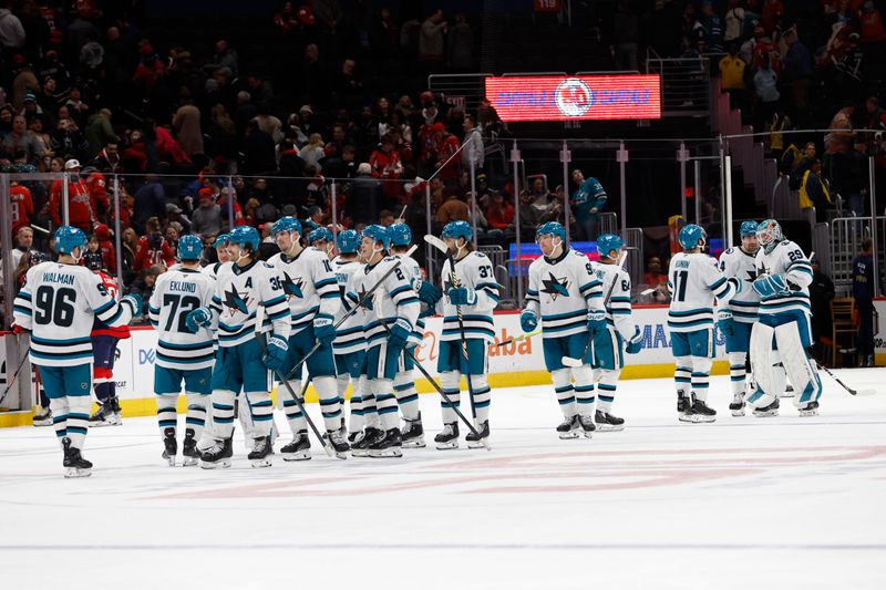 Dec 3, 2024; Washington, District of Columbia, USA; San Jose Sharks goaltender Mackenzie Blackwood (29) celebrates with teammates after their game against the Washington Capitals at Capital One Arena. Mandatory Credit: Geoff Burke-Imagn Images