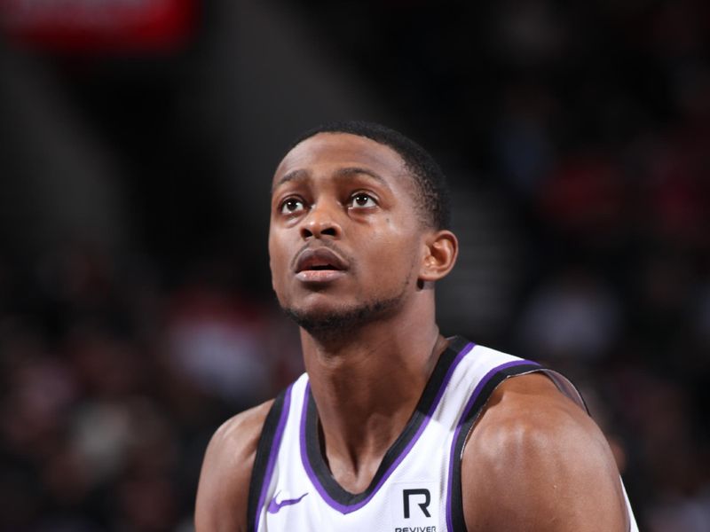 PORTLAND, OR - NOVEMBER 29: De'Aaron Fox #5 of the Sacramento Kings shoots a free throw during the game against the Portland Trail Blazers during the Emirates NBA Cup on November 29, 2024 at the Moda Center Arena in Portland, Oregon. NOTE TO USER: User expressly acknowledges and agrees that, by downloading and or using this photograph, user is consenting to the terms and conditions of the Getty Images License Agreement. Mandatory Copyright Notice: Copyright 2024 NBAE (Photo by Cameron Browne/NBAE via Getty Images)