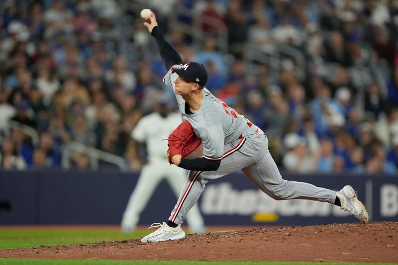 May 10, 2024; Toronto, Ontario, CAN; Minnesota Twins pitcher Griffin Jax (22) pitches to the Toronto Blue Jays during the ninth inning at Rogers Centre. Mandatory Credit: John E. Sokolowski-USA TODAY Sports