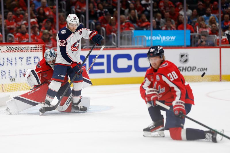 Nov 2, 2024; Washington, District of Columbia, USA; Washington Capitals goaltender Logan Thompson (48) and and Columbus Blue Jackets right wing Kevin Labanc (62) look on as Capitals defenseman Rasmus Sandin (38) blocks a shot in the second period at Capital One Arena. Mandatory Credit: Geoff Burke-Imagn Images