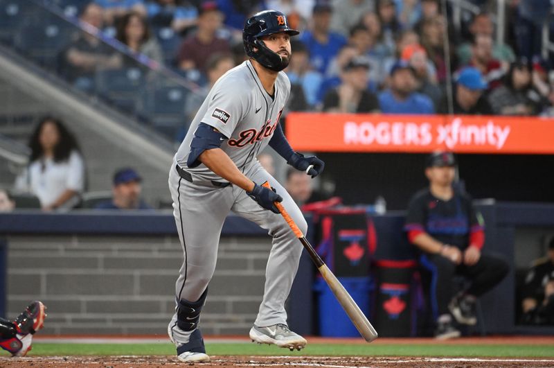 May 16, 2025; Toronto, Ontario, CAN;  Detroit Tigers left fielder Riley Greene (31) hits a two RBI double against the Toronto Blue Jays in the fifth inning at Rogers Centre. Mandatory Credit: Dan Hamilton-Imagn Images