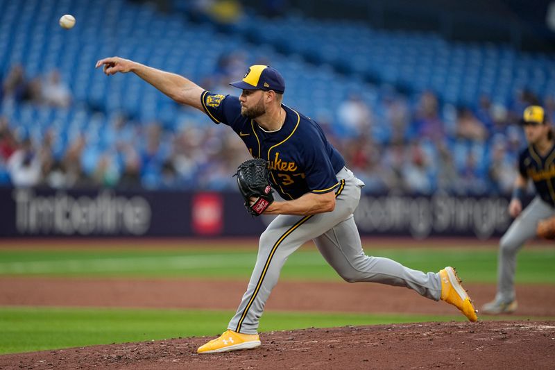 May 30, 2023; Toronto, Ontario, CAN; Milwaukee Brewers starting pitcher Adrian Houser (37) pitches during the first inning at Rogers Centre. Mandatory Credit: John E. Sokolowski-USA TODAY Sports