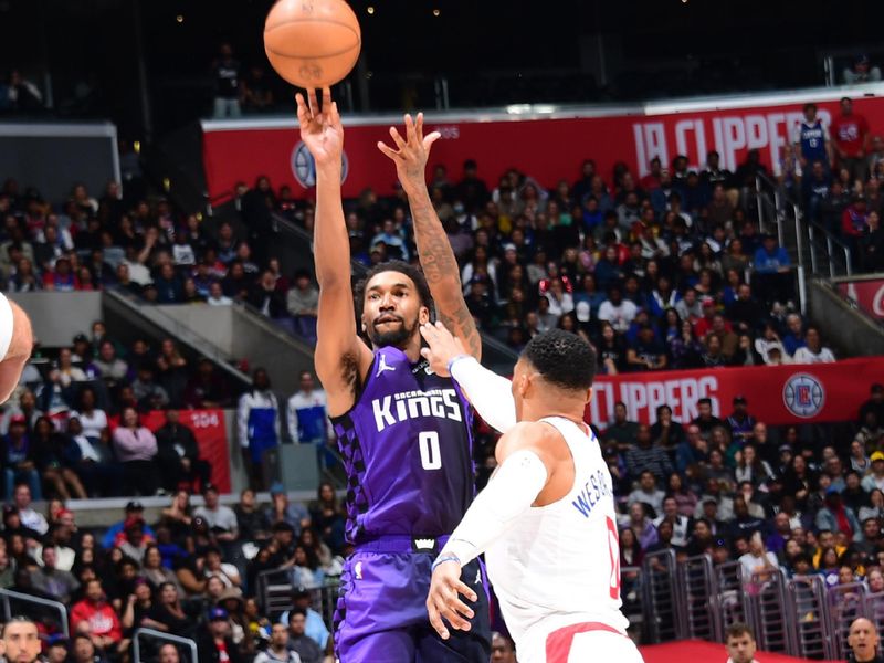 LOS ANGELES, CA - FEBRUARY 25: Malik Monk #0 of the Sacramento Kings shoots the ball during the game against the LA Clippers on February 25, 2024 at Crypto.Com Arena in Los Angeles, California. NOTE TO USER: User expressly acknowledges and agrees that, by downloading and/or using this Photograph, user is consenting to the terms and conditions of the Getty Images License Agreement. Mandatory Copyright Notice: Copyright 2024 NBAE (Photo by Adam Pantozzi/NBAE via Getty Images)