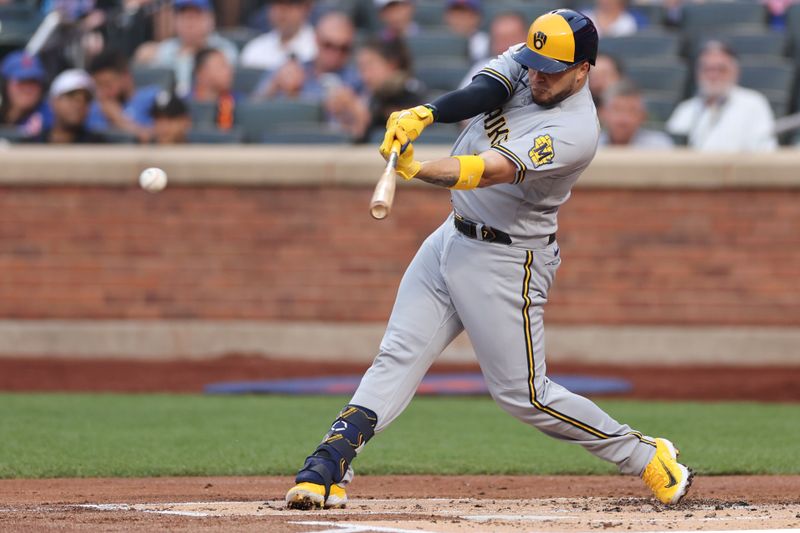 Jun 29, 2023; New York City, New York, USA;  Milwaukee Brewers catcher Victor Caratini (7) singles during the second inning against the New York Mets at Citi Field. Mandatory Credit: Vincent Carchietta-USA TODAY Sports