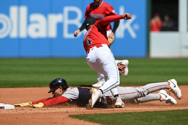Apr 27, 2025; Cleveland, Ohio, USA; Cleveland Guardians shortstop Brayan Rocchio (4) tags out Boston Red Sox left fielder Jarren Duran (16) stealing during the fourth inning at Progressive Field. Mandatory Credit: Ken Blaze-Imagn Images