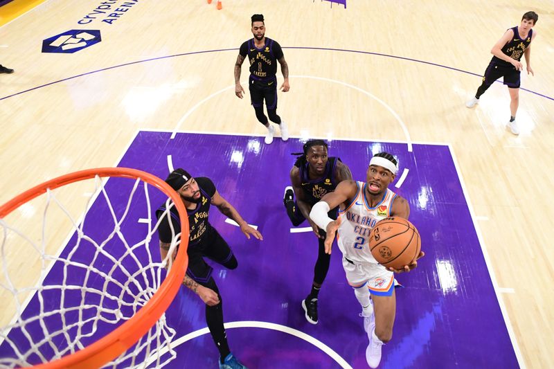 LOS ANGELES, CA - JANUARY 15: Shai Gilgeous-Alexander #2 of the Oklahoma City Thunder drives to the basket during the game against the Los Angeles Lakers on January 15, 2024 at Crypto.Com Arena in Los Angeles, California. NOTE TO USER: User expressly acknowledges and agrees that, by downloading and/or using this Photograph, user is consenting to the terms and conditions of the Getty Images License Agreement. Mandatory Copyright Notice: Copyright 2024 NBAE (Photo by Adam Pantozzi/NBAE via Getty Images)