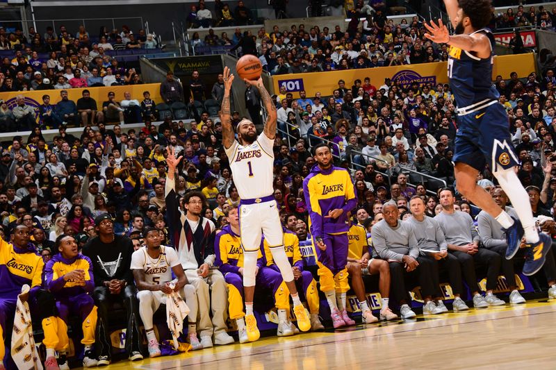 LOS ANGELES, CA - NOVEMBER 23: D'Angelo Russell #1 of the Los Angeles Lakers shoots a three point basket during the game against the Denver Nuggets on November 23, 2024 at Crypto.Com Arena in Los Angeles, California. NOTE TO USER: User expressly acknowledges and agrees that, by downloading and/or using this Photograph, user is consenting to the terms and conditions of the Getty Images License Agreement. Mandatory Copyright Notice: Copyright 2024 NBAE (Photo by Adam Pantozzi/NBAE via Getty Images)