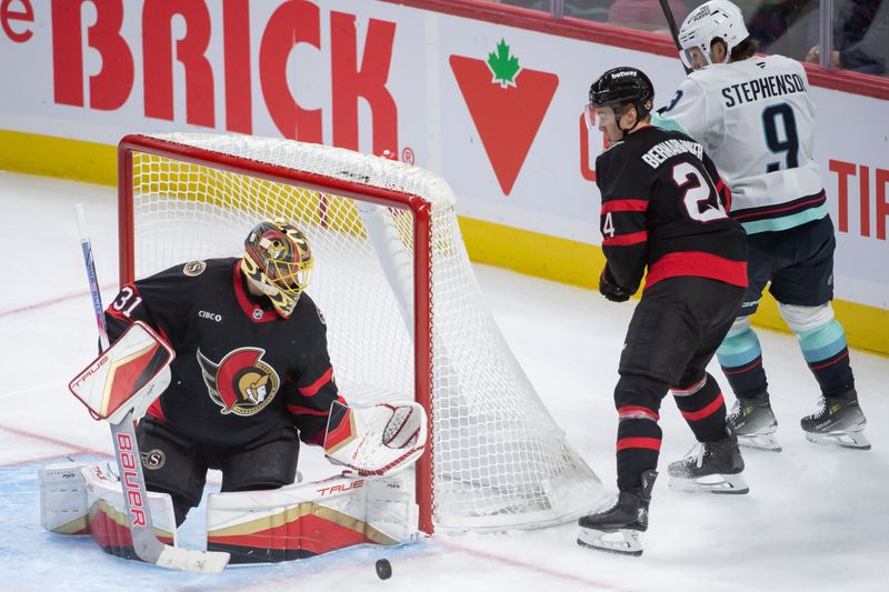 Nov 2, 2024; Ottawa, Ontario, CAN; Ottawa Senators  goalie Anton Forsbrerg (31) makes a save as defenseman Jacob Bernard-Docker (24) moves away from the puck in the third period at the Canadian Tire Centre. Mandatory Credit: Marc DesRosiers-Imagn Images