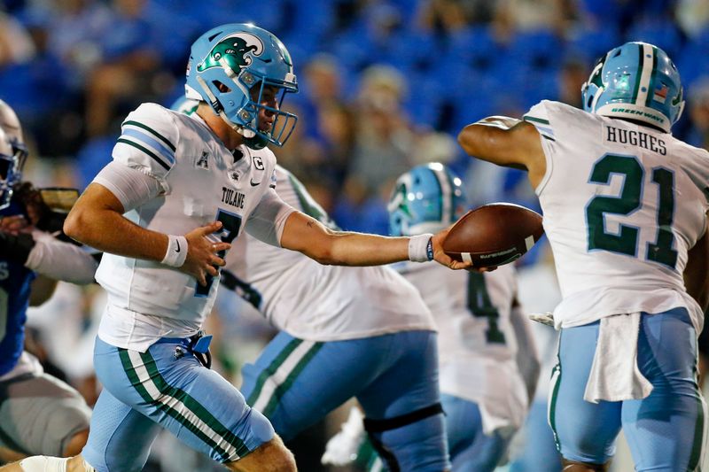 Oct 13, 2023; Memphis, Tennessee, USA; Tulane Green Wave quarterback Michael Pratt (7) hands the ball off to running back Makhi Hughes (21) during the second half against the Memphis Tigers at Simmons Bank Liberty Stadium. Mandatory Credit: Petre Thomas-USA TODAY Sports