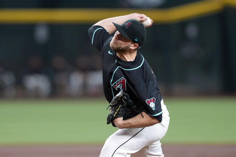 Apr 12, 2025; Phoenix, Arizona, USA; Arizona Diamondbacks pitcher Corbin Burnes (39) pitches against the Milwaukee Brewers during the first inning at Chase Field. Mandatory Credit: Joe Camporeale-Imagn Images