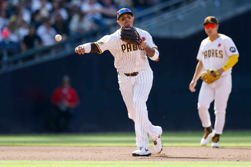 May 27, 2024; San Diego, California, USA;  San Diego Padres third baseman Manny Machado (13) makes the throw to first base for an out in the fifth inning against the Miami Marlins at Petco Park. Mandatory Credit: David Frerker-USA TODAY Sports