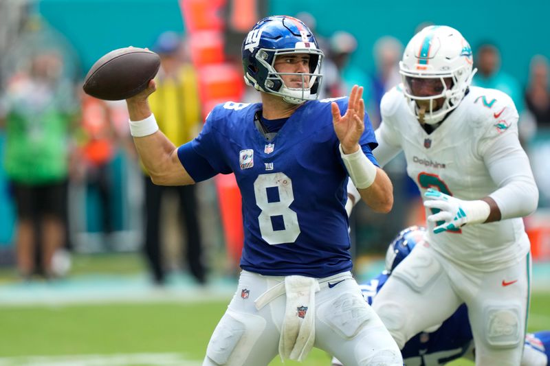 New York Giants quarterback Daniel Jones (8) aims a pass during the second half of an NFL football game against the Miami Dolphins, Sunday, Oct. 8, 2023, in Miami Gardens, Fla. (AP Photo/Wilfredo Lee)