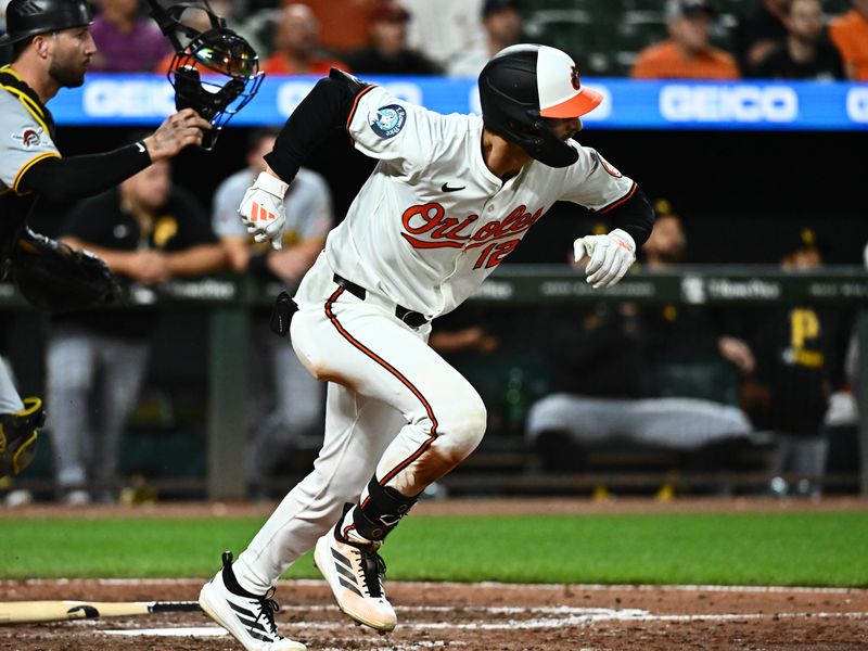 Sep 9, 2025; Baltimore, Maryland, USA;  Baltimore Orioles outfielder Dylan Beavers (12) completes a sacrifice bunt during the tenth inning against the Pittsburgh Pirates at Oriole Park at Camden Yards. Mandatory Credit: James A. Pittman-Imagn Images