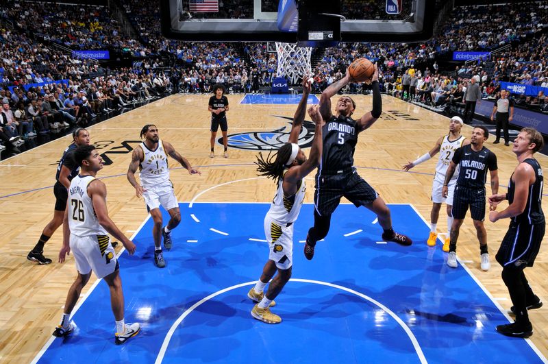 ORLANDO, FL - OCTOBER 28: Paolo Banchero #5 of the Orlando Magic shoots the ball during the game against the Indiana Pacers on October 28, 2024 at Kia Center in Orlando, Florida. NOTE TO USER: User expressly acknowledges and agrees that, by downloading and or using this photograph, User is consenting to the terms and conditions of the Getty Images License Agreement. Mandatory Copyright Notice: Copyright 2024 NBAE (Photo by Fernando Medina/NBAE via Getty Images)