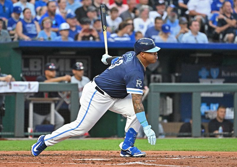 Jun 28, 2024; Kansas City, Missouri, USA;  Kansas City Royals designated hitter Salvador Perez (13) hits a RBI single in the third inning against the Cleveland Guardians at Kauffman Stadium. Mandatory Credit: Peter Aiken-USA TODAY Sports