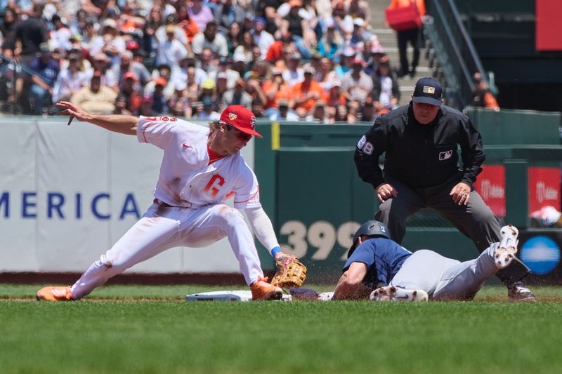 Jul 4, 2023; San Francisco, California, USA; San Francisco Giants infielder Casey Schmitt (6) tags out Seattle Mariners outfielder Jarred Kelenic (10) at second base and second base umpire Doug Eddings (88) watches the play during the first inning at Oracle Park. Mandatory Credit: Robert Edwards-USA TODAY Sports