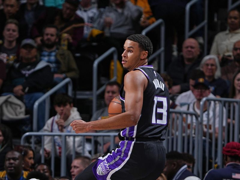 DENVER, CO - FEBRUARY 28: Keegan Murray #13 of the Sacramento Kings saves loose ball during the game against the Denver Nuggets on February 28, 2024 at the Ball Arena in Denver, Colorado. NOTE TO USER: User expressly acknowledges and agrees that, by downloading and/or using this Photograph, user is consenting to the terms and conditions of the Getty Images License Agreement. Mandatory Copyright Notice: Copyright 2024 NBAE (Photo by Garrett Ellwood/NBAE via Getty Images)